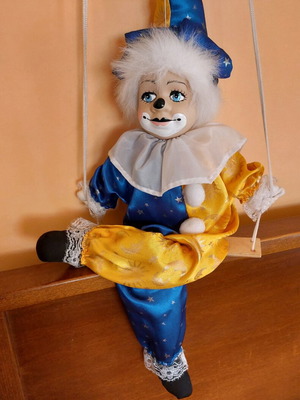 Vintage clown marionette on a swing used with ceramic head