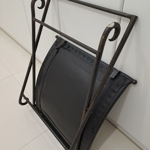 Leather footstool like new, black with cast iron frame