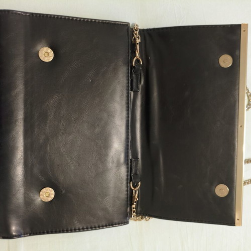 Black clutch bag with gold chain used, synthetic leather