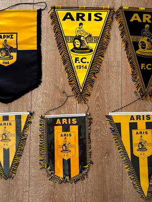 Aris six captain pennants from matches
