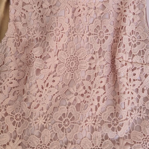 Lace dress in salmon peach shade with floral pattern and waist detail