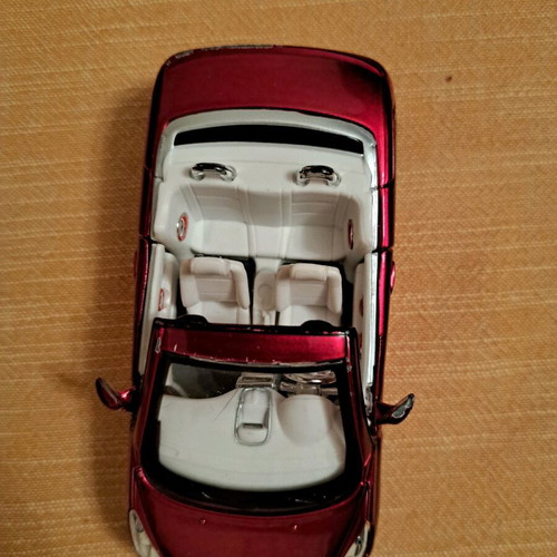 Peugeot 207cc Burago 1/32 like new, burgundy color