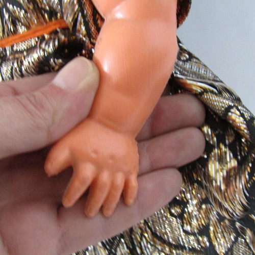 Vintage souvenir doll with traditional oriental costume used