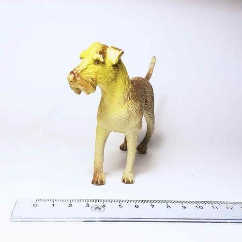 Dog plastic figure used with scratches and marks