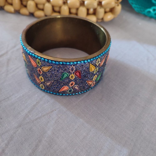 Ethnic bracelet made of brass with intricate colorful designs like new
