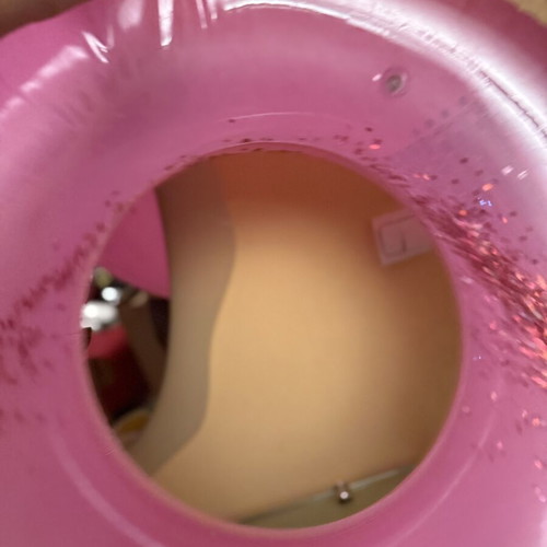 Pink inflatable pool float with glitter
