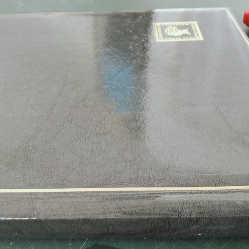 Stamp collection album like new, dark green leather-bound