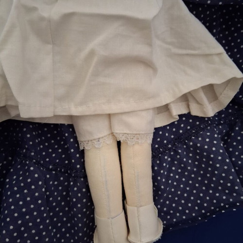Vintage Slavic doll with porcelain head and fabric body