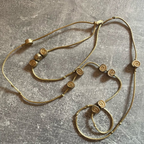 Gold necklace with spirals used