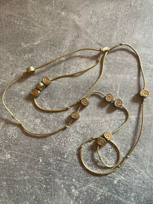 Gold necklace with spirals used