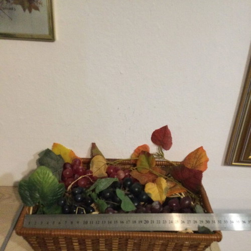 Basket with fake grapes like new