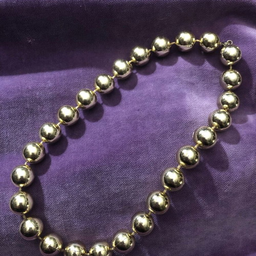 Necklace with gold-colored beads used, clasp needs replacement