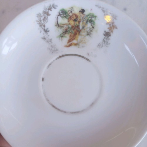 Porcelain vintage plates used, set of two with gold details