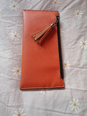 Orange wallet with six card slots and two bill compartments