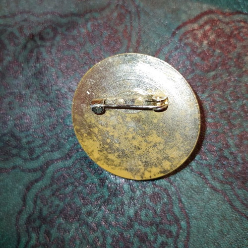 Vintage pin used with signs of wear