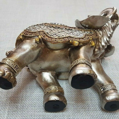 Handmade wooden elephant used with decorations and crystals