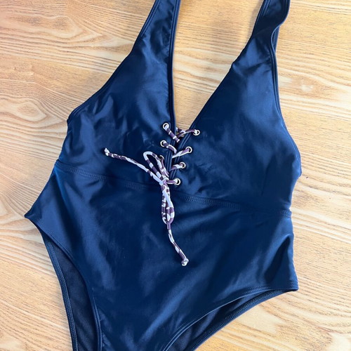 Black one-piece swimsuit with animal print cord, size L, like new