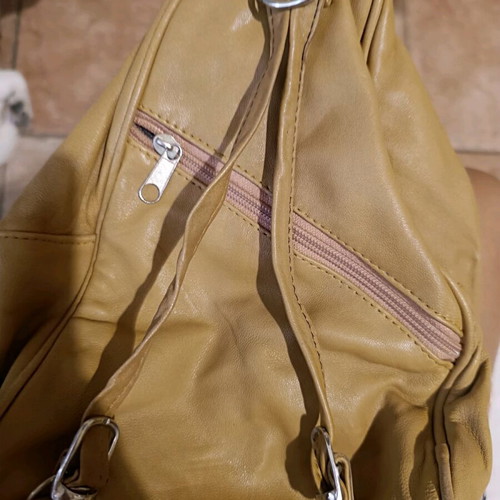 Leather backpack beige like new with multiple pockets and zippers