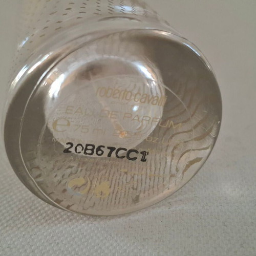 Roberto Cavalli Oro and Christian Dior J'adore empty perfume bottles
