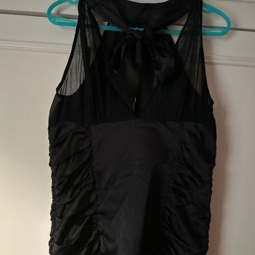 Twentyone L, women's black blouse, made of satin and muslin. The bow at the back.