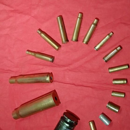 Empty deactivated cartridge cases used, various calibers including M-230 from AH-64 Apache