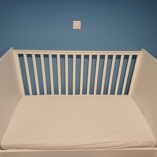 Baby cot with rails, like new, includes mattress and protector