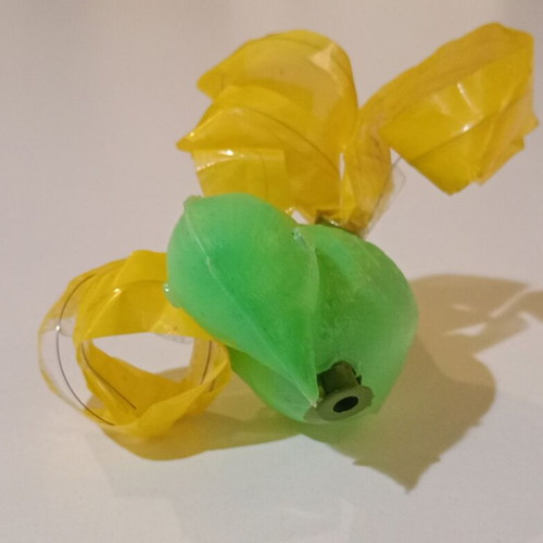 Plastic bird-shaped whistle used, green color