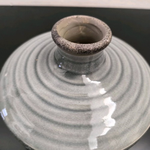 Ceramic low vase in gray shades like new