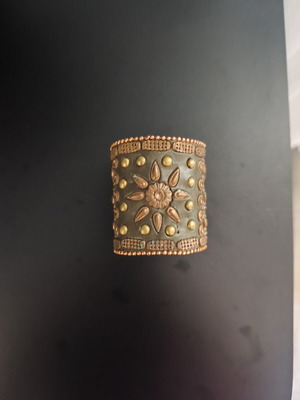 Boho handmade bracelet with embossed decorations, brown