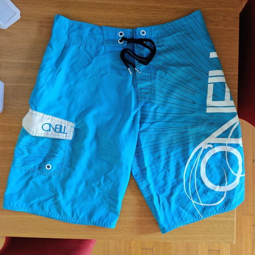 O'Neill Surfer Swim Shorts like new, built-in wax scraper, size M, blue