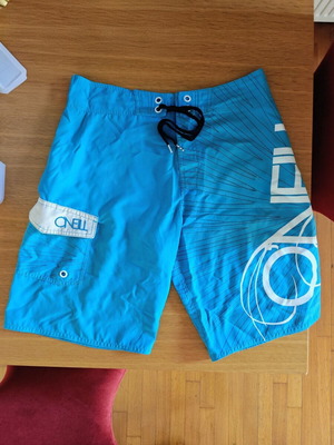 O'Neill Surfer Swim Shorts like new, built-in wax scraper, size M, blue