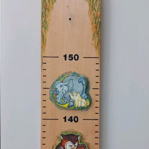 Wooden wall height chart used, natural wood