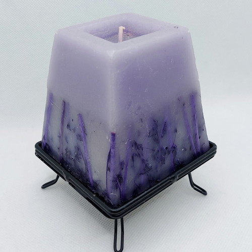 Decorative purple lavender candle with metal base