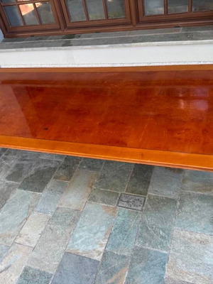 Solid wood dining table with decorative border and square legs