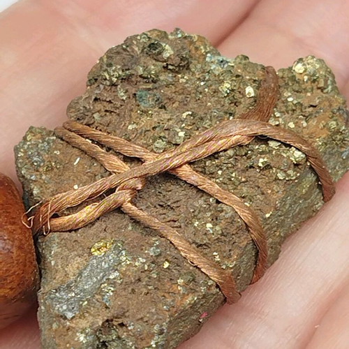 Pendant with pyrite new, gold copper wire and leather