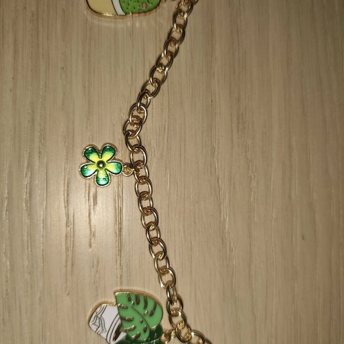 Bracelet new with green shades and gold details