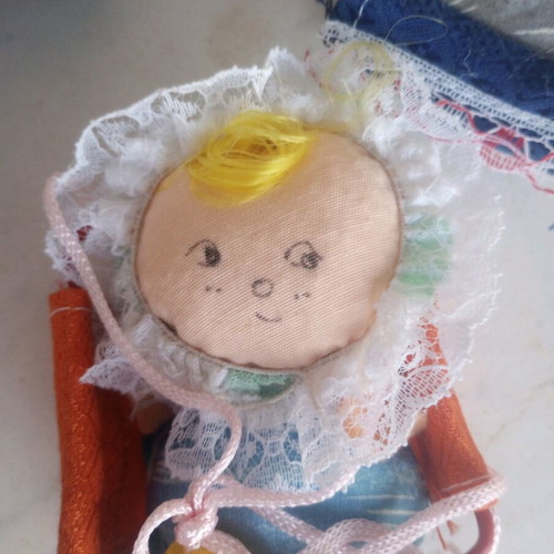 Seven cloth baby dolls in cradle new
