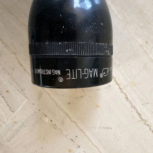 Flashlight used with swollen battery