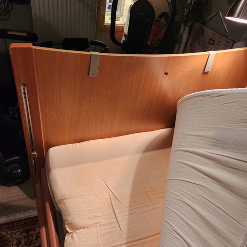 Electric hospital bed used with headboard