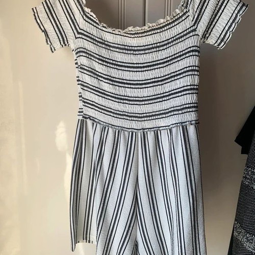 Set of two playsuits rompers like new, black floral and striped Bershka