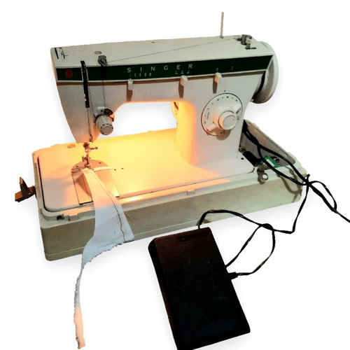 Singer sewing machine made in Brazil 220V like new with case and accessories