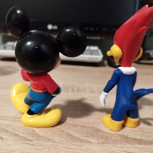 Mickey Mouse and Woody figures like new