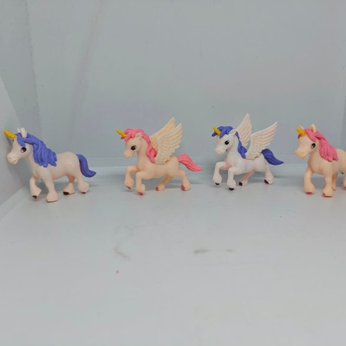 Set of 4 unicorn and pegasus figures like new