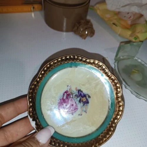 Vintage porcelain plates set of 4 with romantic design and gold trim used