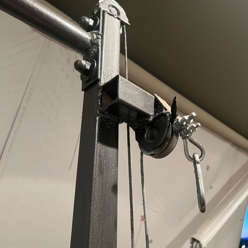 Training rack with barbell and pulley system