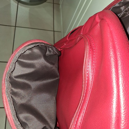 Women's red backpack with gold details