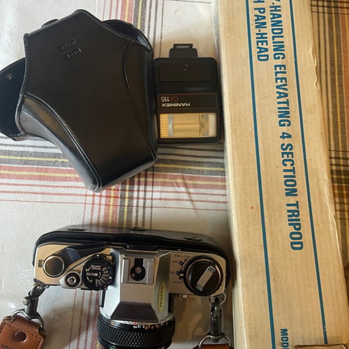 Olympus camera with tripod, flash and lens unused