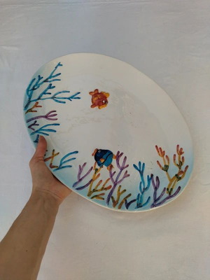 Large porcelain serving platter with embossed sea bottom theme used