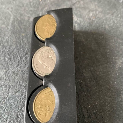 Coin holder used, as shown with coins