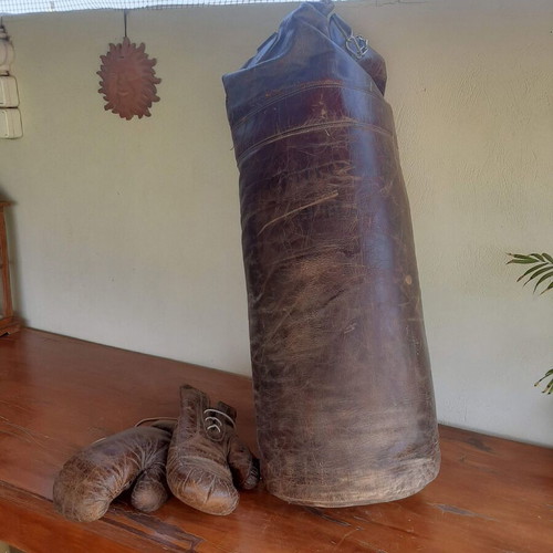 Antique leather boxing bag and gloves with Dublin college stamp